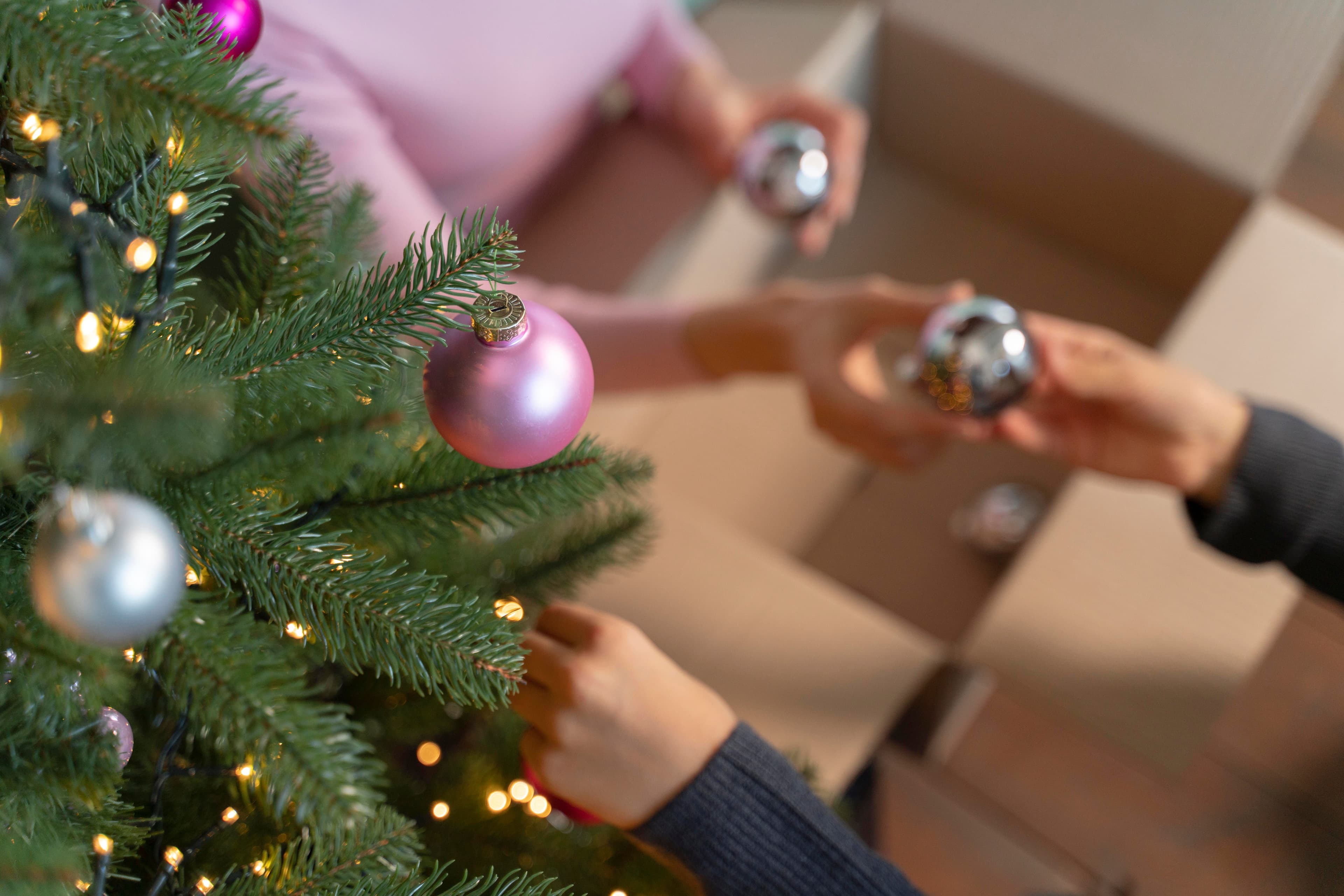 Packing ornaments from a Christmas tree for storage